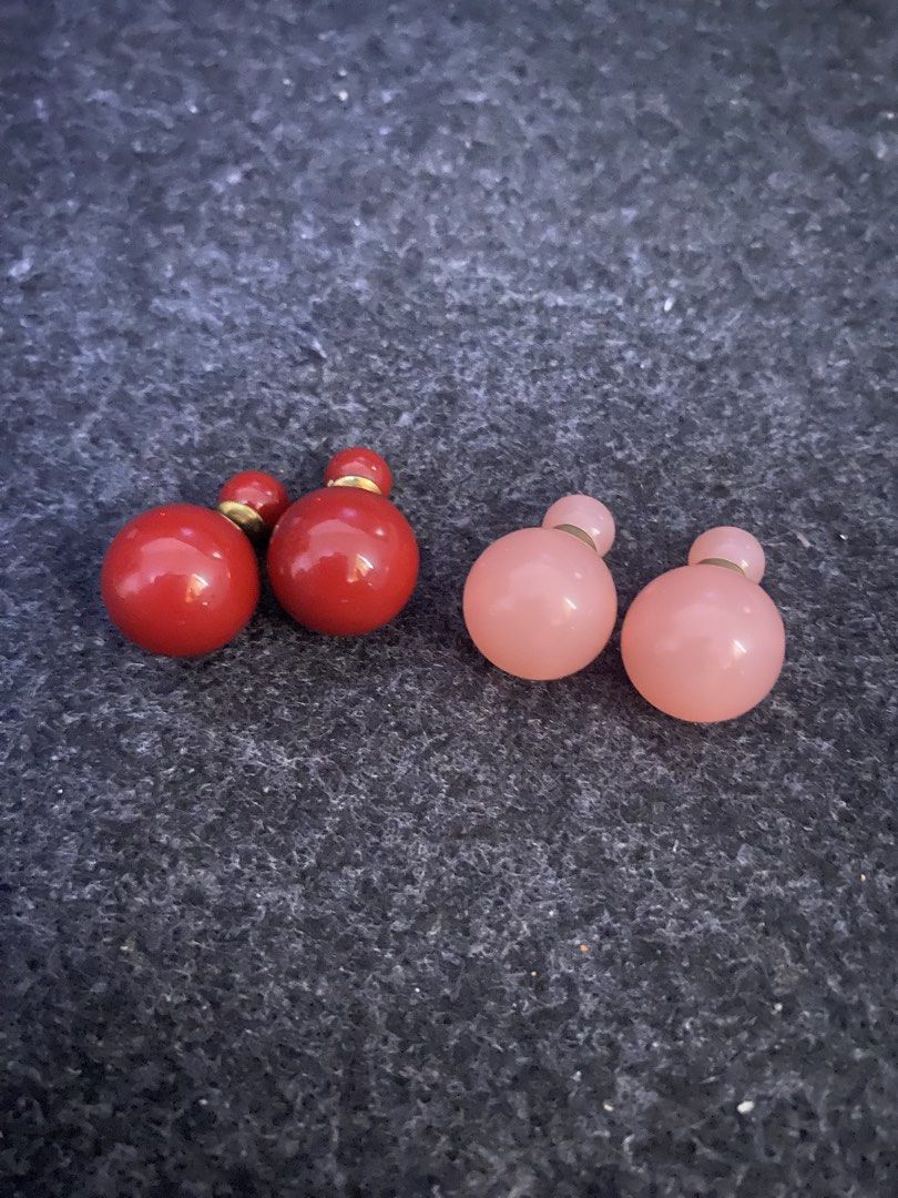 Double Ball Stud Earrings - Red and Pink (Category: Earrings) located in San Pedro. Submitted by chinitagrace21 (Listing ID 1448996739, Image 1). Description: - Set of two pairs of double ball stud earrings. - One pair in vibrant red, the other in soft pink. - Features visible gold-tone posts. - Versatile design for multiple styling options. - Perfect for adding a pop of color to any outfit. - Feel free to ask any questions!.