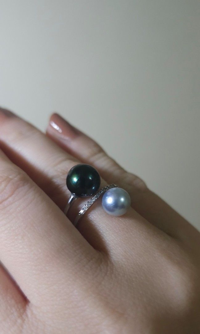 Double South Sea Pearl with certificate (Category: Rings) located in Batangas. Submitted by finestonesandfindsph (Listing ID 1449079909, Image 2). Description: - Unique crossover ring design - Features two pearls: one dark grey, one light grey - Accented with small stones along the band micron settings -with certificate - Adds a touch of sparkle to any outfit - Ideal for gifting or personal indulgence.
