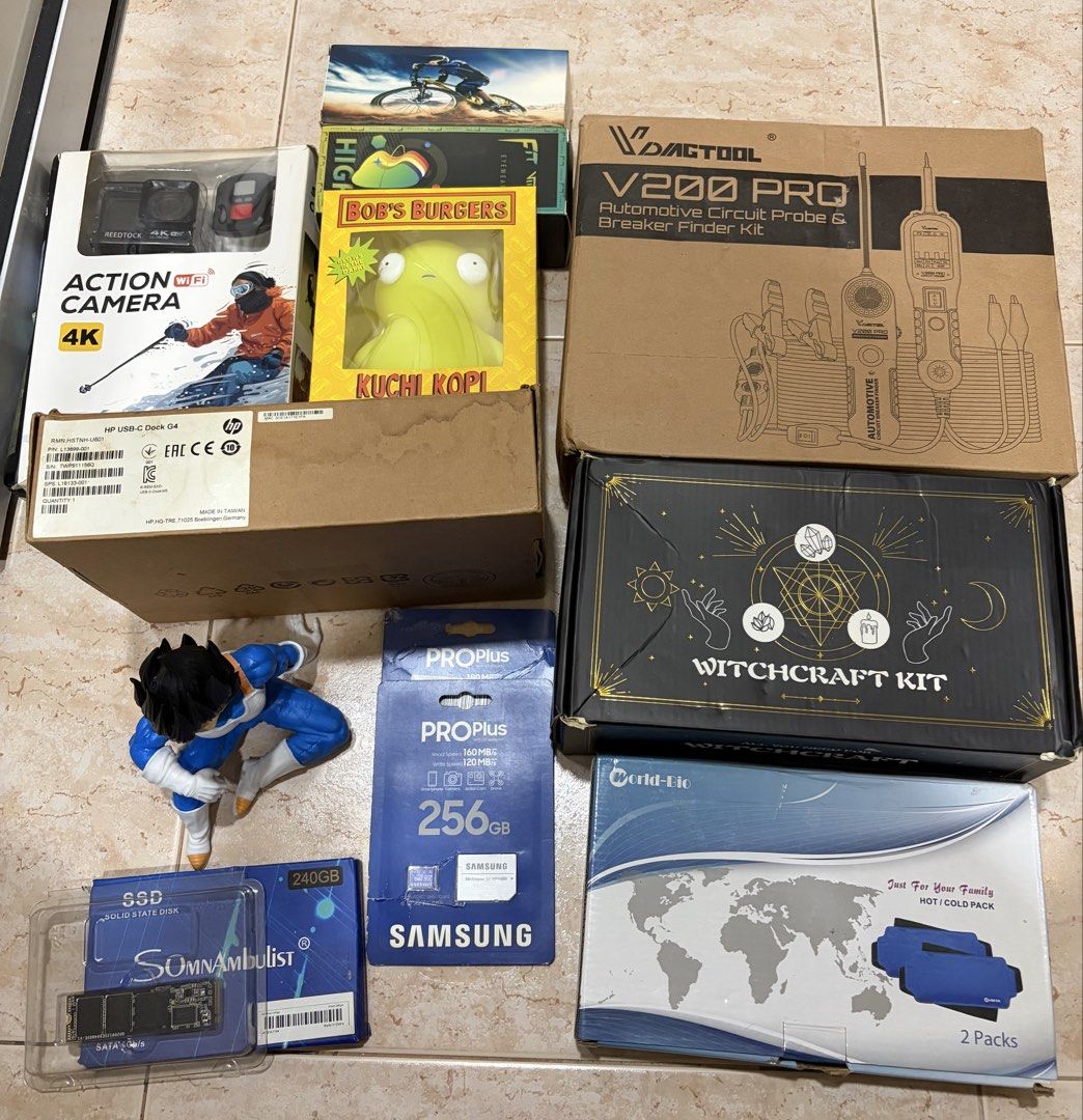 ELECTRONIC BUNDLE (Category: Other Gadgets) located in Singapore. Submitted by blaankxx (Listing ID 1449022392, Image 1). Description: Getting rid of stock auction item - 4K Action Camera - Bob's Burgers Kuchi Kopi Plush - Witchcraft Kit - SOMAmbulist 240GB SSD - Samsung PROPlus 256GB SD Card - VamTool V200 PRO Automotive Circuit Probe & Breaker Finder Kit - Bicycle-themed Item - World-Elec 2-Pack Hot/Cold Pack - HP DOCK -DRAGON BALL FIGURE.