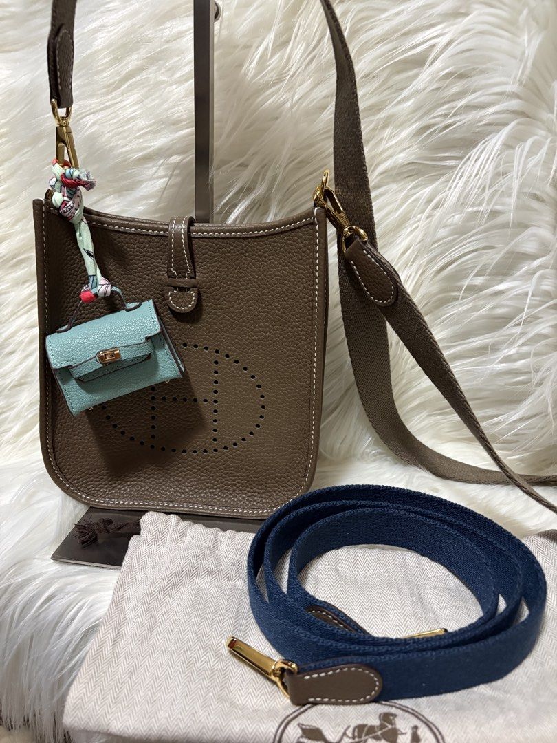 Evelyne TPM Shoulder Bag (Category: Luxury Bags & Wallets) located in Mandaue City. Submitted by zealhawk_ca52e0 (Listing ID 1448916819, Image 1). Description: - Evelyne size TPM bag - Color: Taupe - Hardware: Gold - Includes: dust bag, extra blue canvas strap, mini bag charm - Ideal for everyday use.