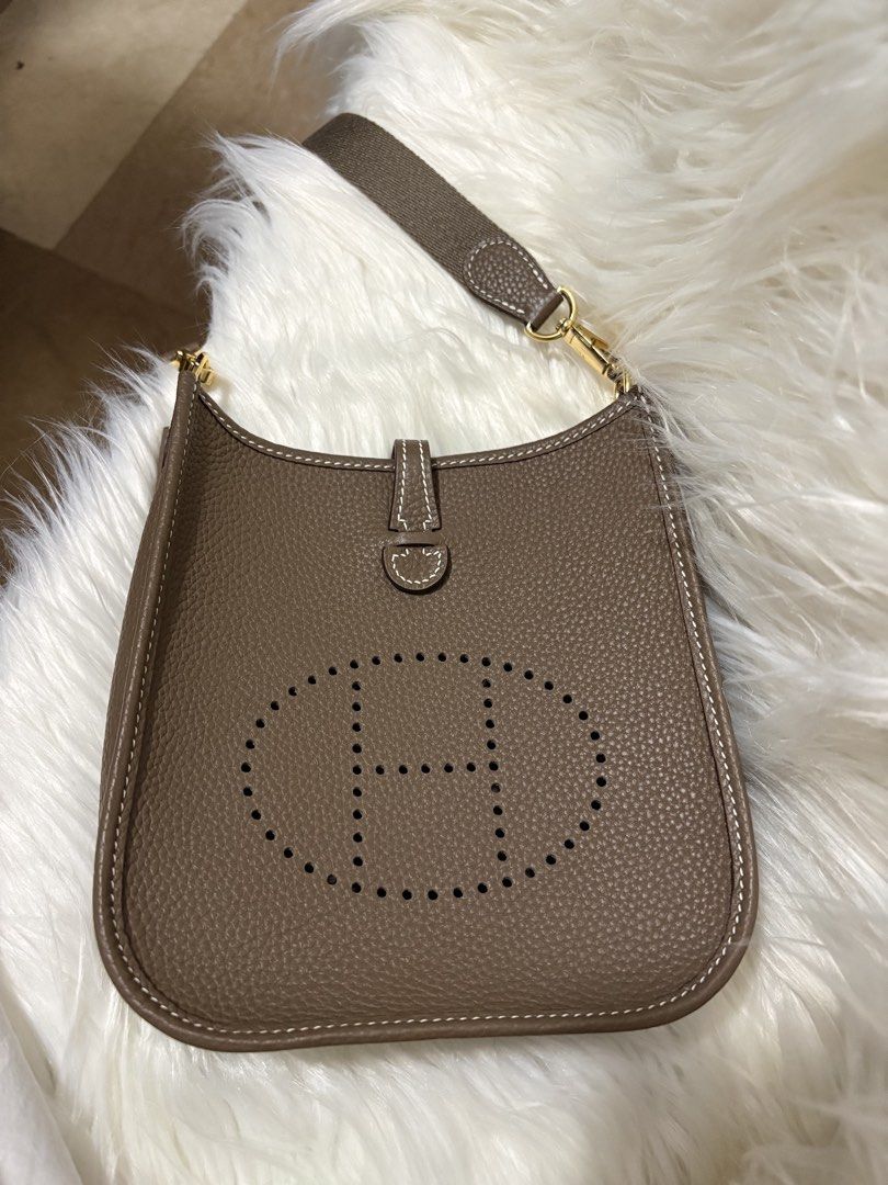 Evelyne TPM Shoulder Bag (Category: Luxury Bags & Wallets) located in Mandaue City. Submitted by zealhawk_ca52e0 (Listing ID 1448916819, Image 3). Description: - Evelyne size TPM bag - Color: Taupe - Hardware: Gold - Includes: dust bag, extra blue canvas strap, mini bag charm - Ideal for everyday use.