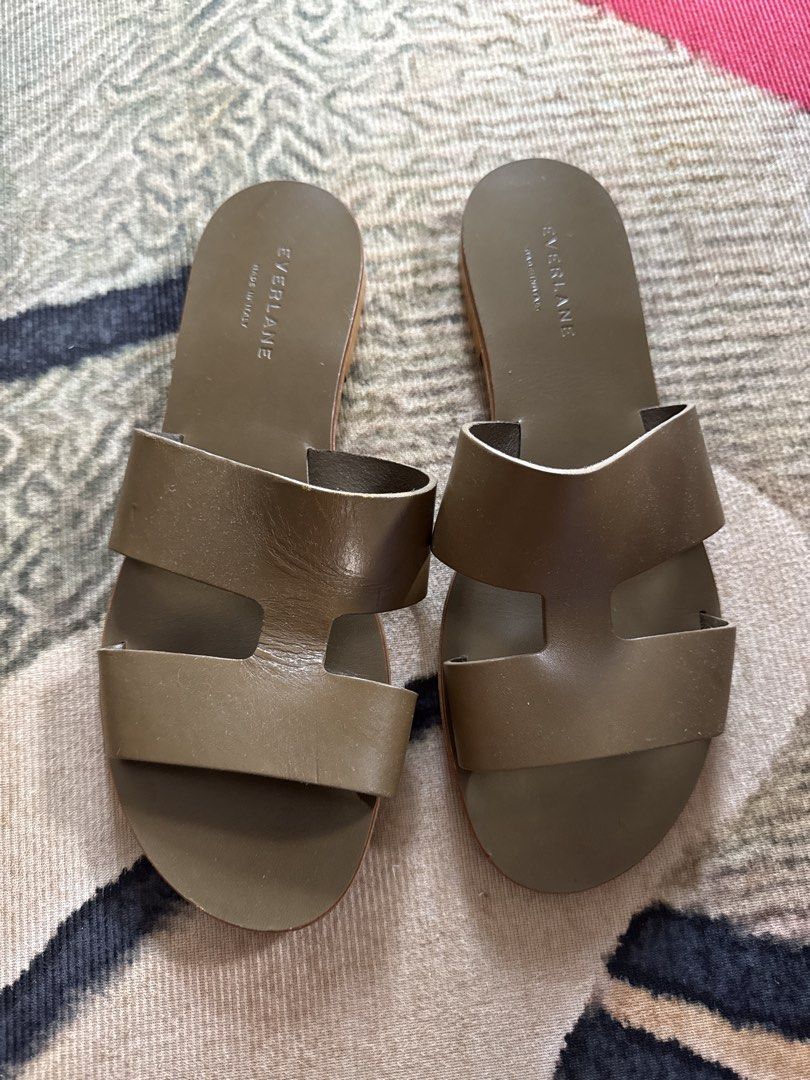 Everlane Leather Slides Made in Italy (Category: Flats & Sandals) located in Quezon City. Submitted by thebubbly (Listing ID 1448941823, Image 1). Description: - Everlane Olive Green Leather Slides - Made in Italy - Open toe design - Two wide straps across the foot - Flat sole - Shows some wear on soles - Comfortable and easy to slip on _no 10 but 26cm size 8.