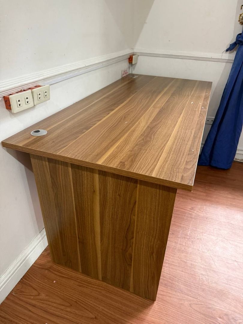 Executive Office Desk | Large Wooden Computer Table with Cable Grommets (Category: Tables & Sets) located in Pasig City. Submitted by rctaneo24 (Listing ID 1449031063, Image 2). Description: Upgrade your home office or workspace with this sturdy executive office desk featuring a modern wood finish. Spacious tabletop provides plenty of room for a laptop, monitor, keyboard, and office essentials. Includes 2 built-in cable management grommets for a 