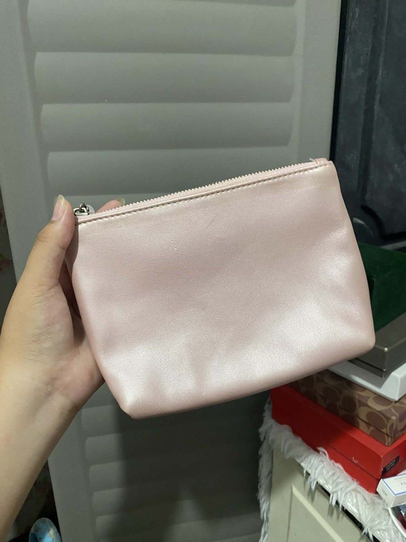 Flower Knows Pink Pouch for Cosmetics (Category: Purses & Pouches) located in Manila. Submitted by itsayespurchase_21 (Listing ID 1449098899, Image 3). Description: - Adorable pink cosmetic bag - Features charming velvet bows all over the front - Zipper adorned with a delicate pearl charm - Lined with a soft pink interior - Ideal for storing makeup or small essentials - Compact and easy to carry for on-the-go use.