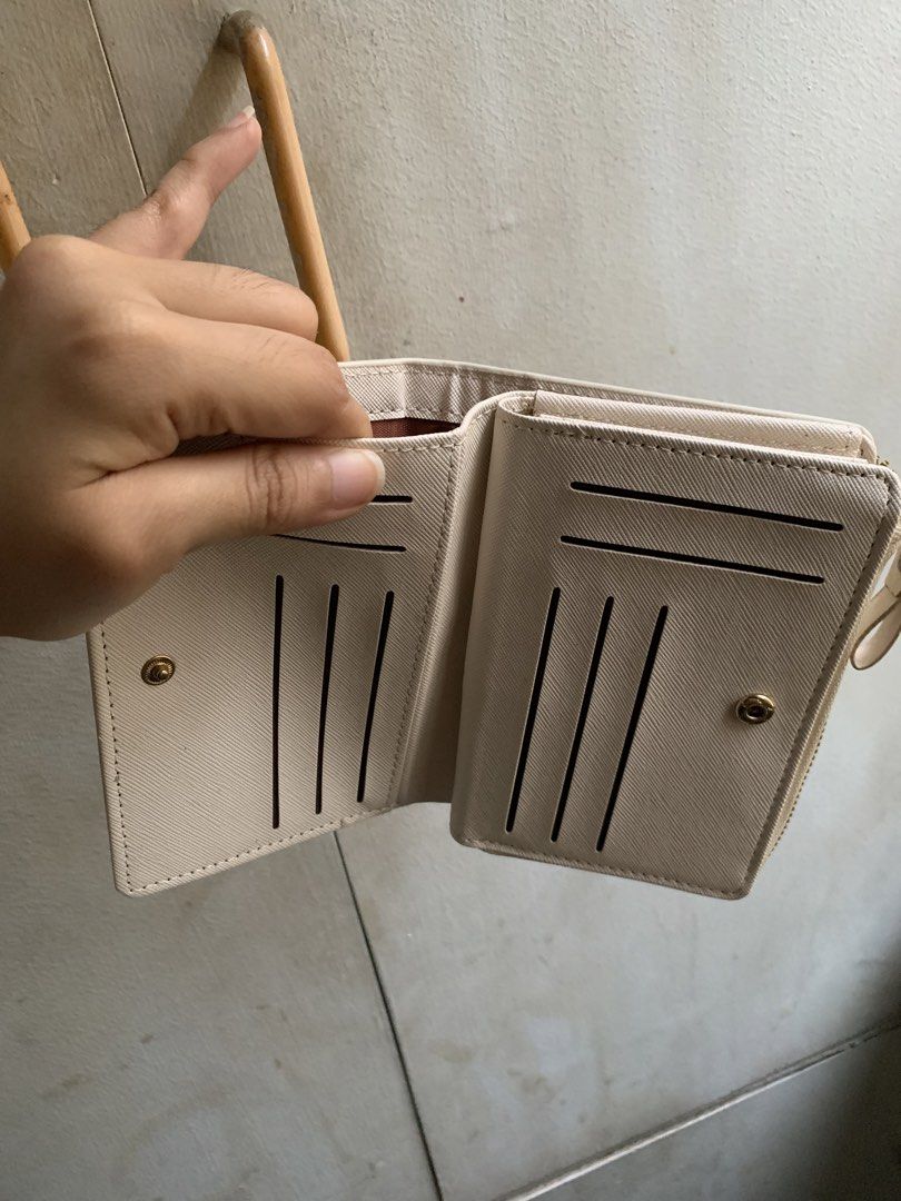 Wallet (Category: Wallets & Card holders) located in Manila. Submitted by usagichan_rabbit (Listing ID 1449105369, Image 3). Description: - Brand: Forever Lovely - Design: Madley - Color: Beige/Cream - Features: Multiple card slots, Zipper closure good condition needs cleaning.