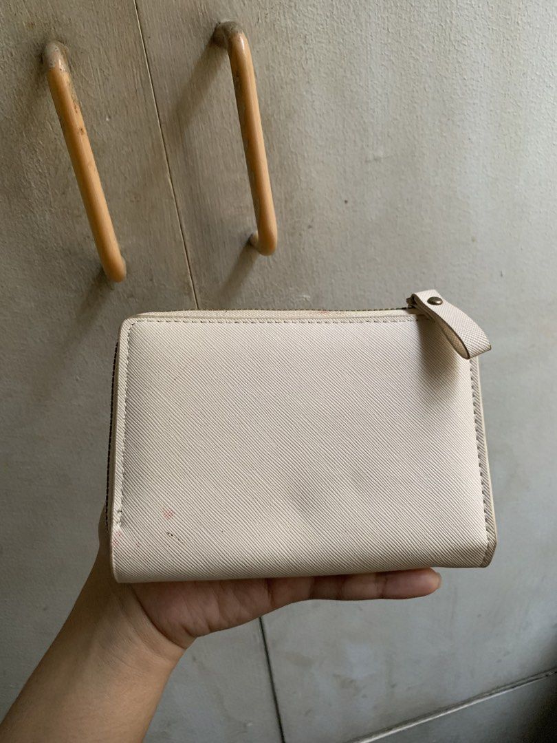 Wallet (Category: Wallets & Card holders) located in Manila. Submitted by usagichan_rabbit (Listing ID 1449105369, Image 2). Description: - Brand: Forever Lovely - Design: Madley - Color: Beige/Cream - Features: Multiple card slots, Zipper closure good condition needs cleaning.