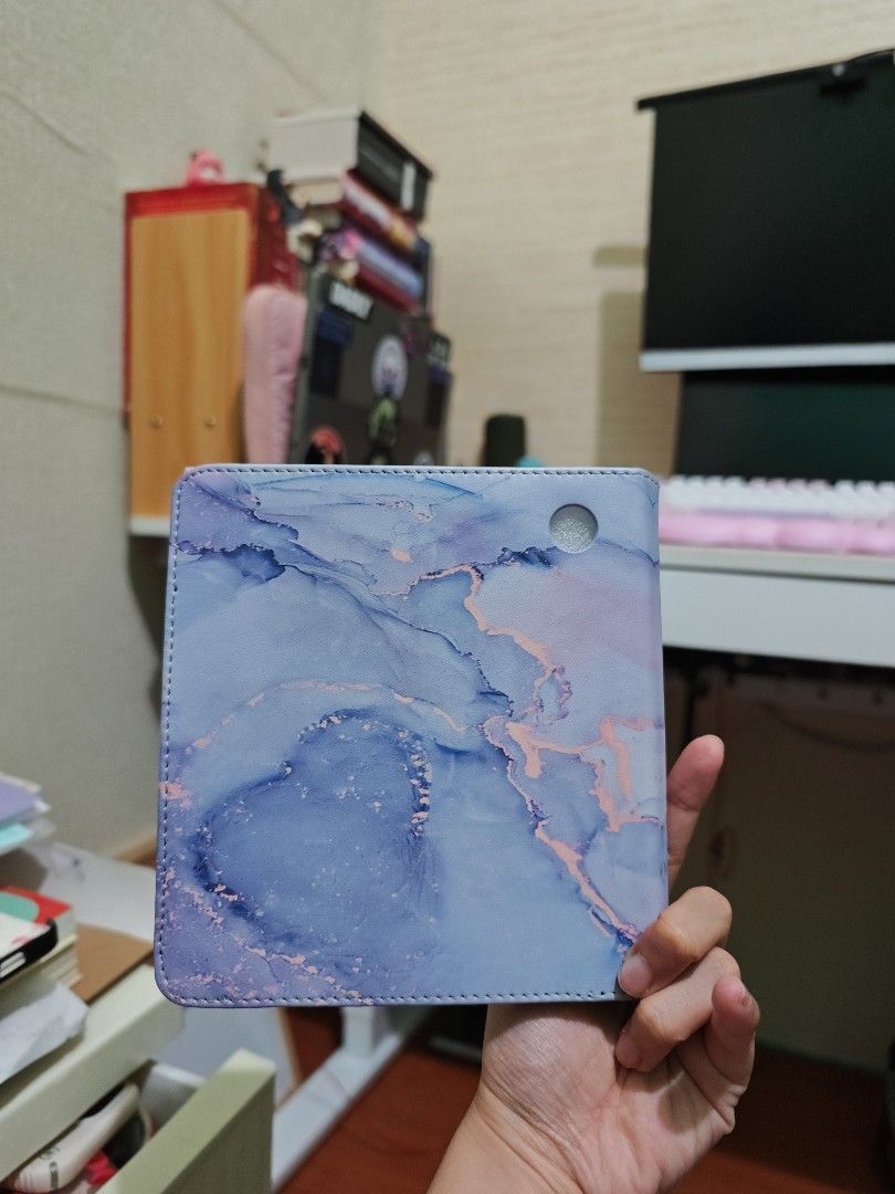Free if you buy Kobo Libra Case (Category: E-Readers) located in Quezon City. Submitted by isabuys (Listing ID 1449025610, Image 3). Description: - Adorable marble design with light blue and purple swirl pattern. - Built-in slots for cards or cash. - Folding cover protects your tablet's screen. - Universal fit for most standard tablets. - Keep your device safe and stylish!.