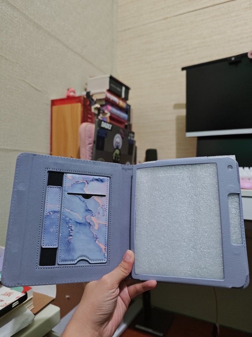 Free if you buy Kobo Libra Case (Category: E-Readers) located in Quezon City. Submitted by isabuys (Listing ID 1449025610, Image 2). Description: - Adorable marble design with light blue and purple swirl pattern. - Built-in slots for cards or cash. - Folding cover protects your tablet's screen. - Universal fit for most standard tablets. - Keep your device safe and stylish!.
