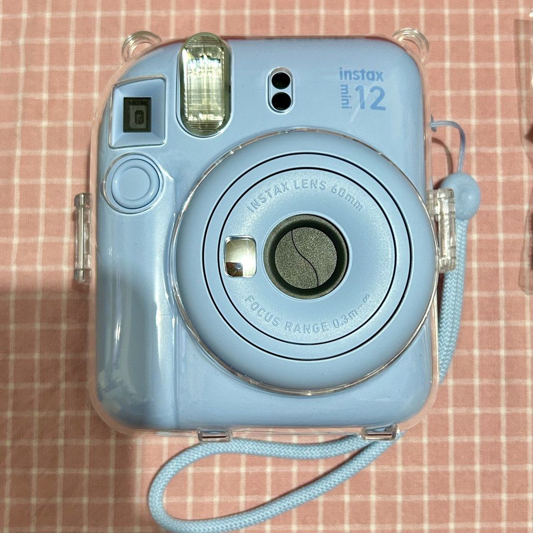 Fujifilm Instax Mini 12 Pastel Blue Camera Bundle (Category: Cameras) located in Quezon City. Submitted by ellevt (Listing ID 1449105737, Image 2). Description: - Fujifilm Instax Mini 12 Camera (Pastel Blue) - Original Box Included - Black Camera Case - Photo Storage Frame Set - Photo Album - Pack of Instax Patches - Set of Colored Lenses - Rarely used. I upgraded to mini evo shortly after purchasing this..