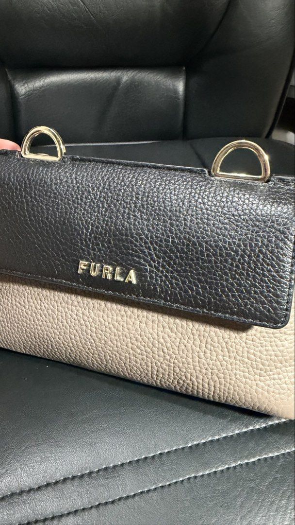 Furla sling bag (preloved; guaranteed authentic) (Category: Luxury Bags & Wallets) located in Manila. Submitted by anne_r23 (Listing ID 1449092736, Image 2). Description: can fit an iphone pro comes with dustbag.