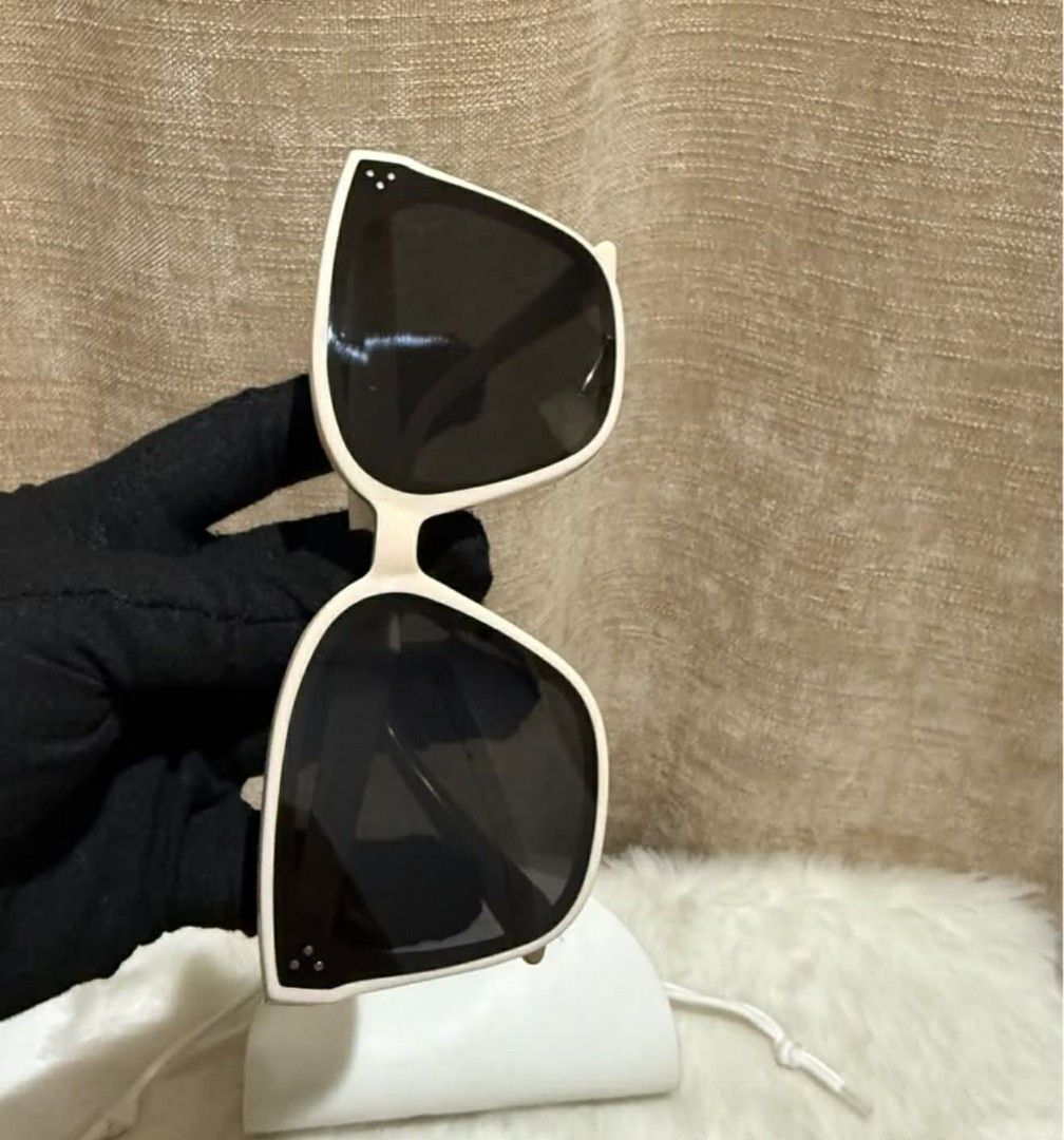 Gentle Monster Sunglasses with Case (Category: Sunglasses & Eyewear) located in Caloocan City. Submitted by mommyella22 (Listing ID 1446480605, Image 2). Description: - Brand: Gentle Monster - Frame Color: Cream - Lens Color: Black - Includes: Original white case - Perfect for: Sunny days.