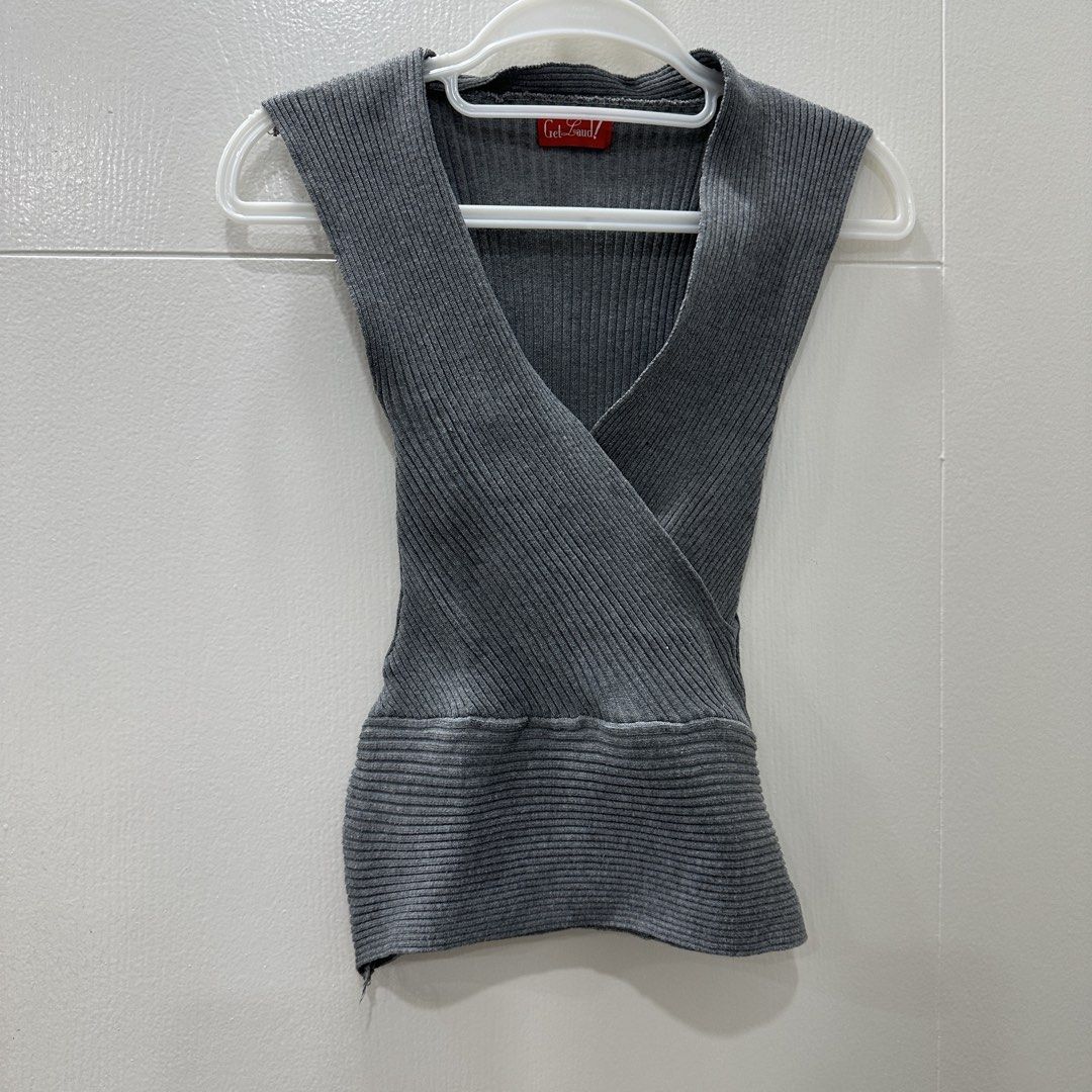 Get Laud! Grey Ribbed V-Neck Sleeveless Wrap Top (Category: Sleeveless) located in Quezon City. Submitted by _cc_declutters (Listing ID 1449082494, Image 2). Description: - Grey sleeveless top from Get Laud! - Ribbed knit material - V-neck wrap design - Fitted at the waist - Estimated size S or M - Versatile for layering or wearing alone - Simple and chic style.