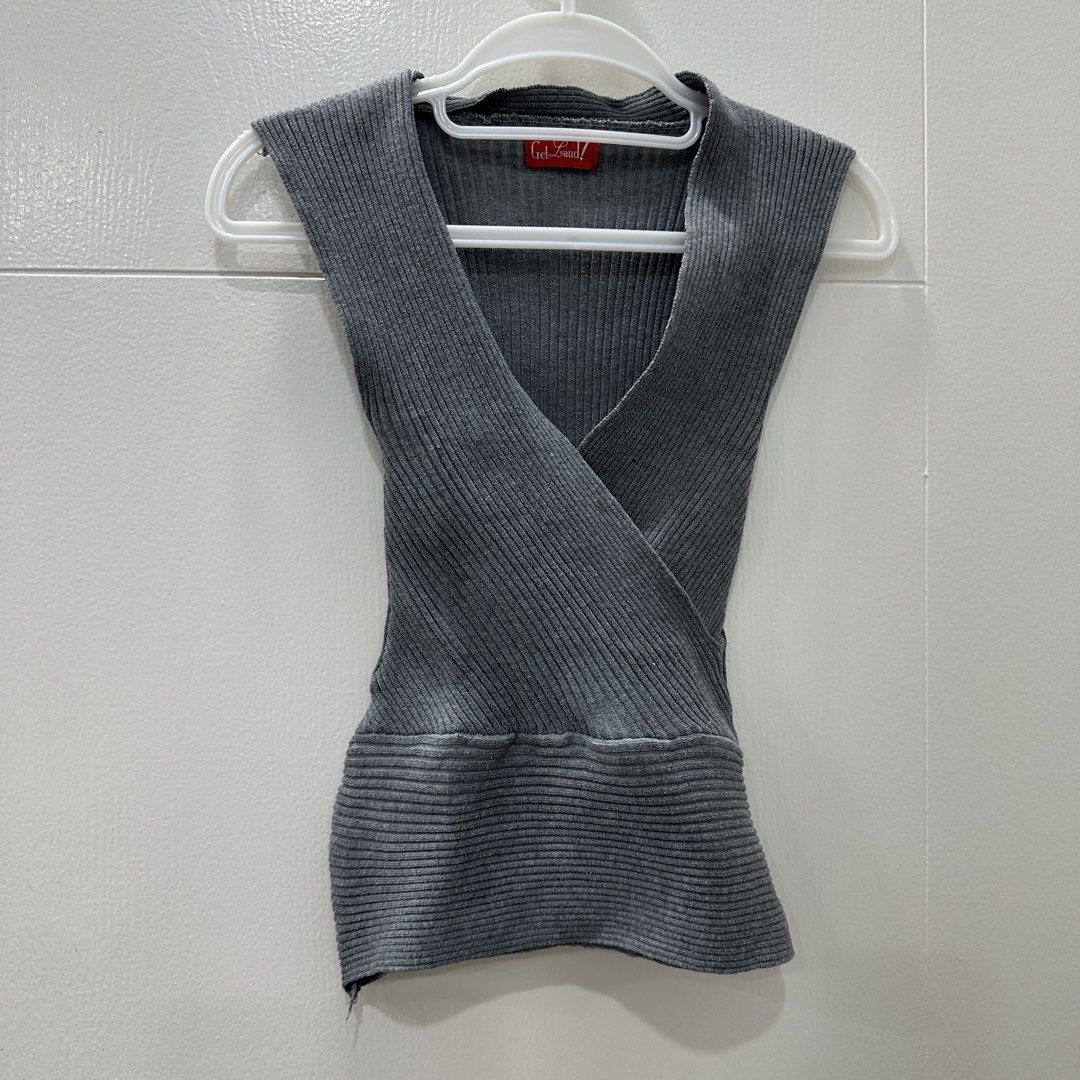 Get Laud! Grey Ribbed V-Neck Sleeveless Wrap Top (Category: Sleeveless) located in Quezon City. Submitted by _cc_declutters (Listing ID 1449082494, Image 1). Description: - Grey sleeveless top from Get Laud! - Ribbed knit material - V-neck wrap design - Fitted at the waist - Estimated size S or M - Versatile for layering or wearing alone - Simple and chic style.
