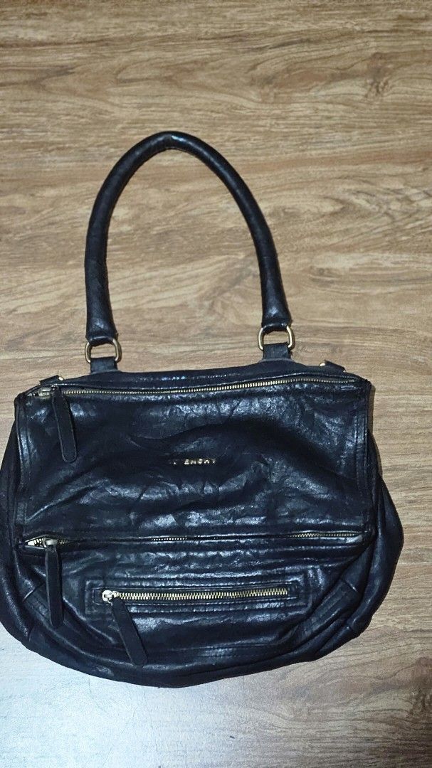 Givenchy bag (Category: Luxury Bags & Wallets) located in Balanga. Submitted by momstyle.ph (Listing ID 1449007555, Image 1). Description: Givenchy Pandora bag missing letter G & V missing sling strap Made in Italy Sale price ❤️.