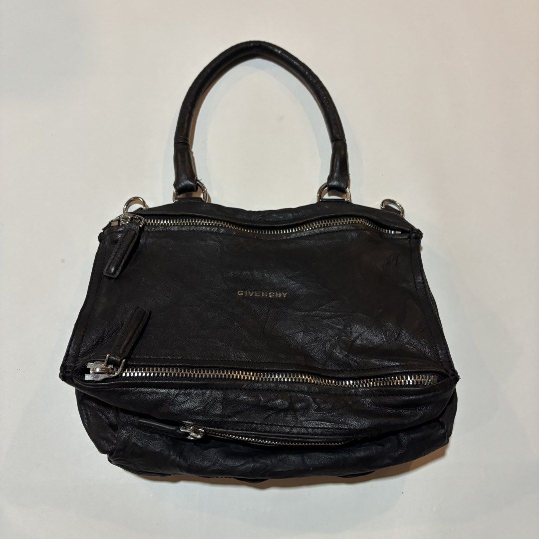Givenchy Black Leather Nightingale Bag (Category: Luxury Bags & Wallets) located in Dipolog. Submitted by dionato (Listing ID 1449085536, Image 1). Description: - Iconic Givenchy Nightingale bag - Genuine black leather - Made in Italy - Multiple zipper details - Spacious interior - Perfect for everyday or special occasions.