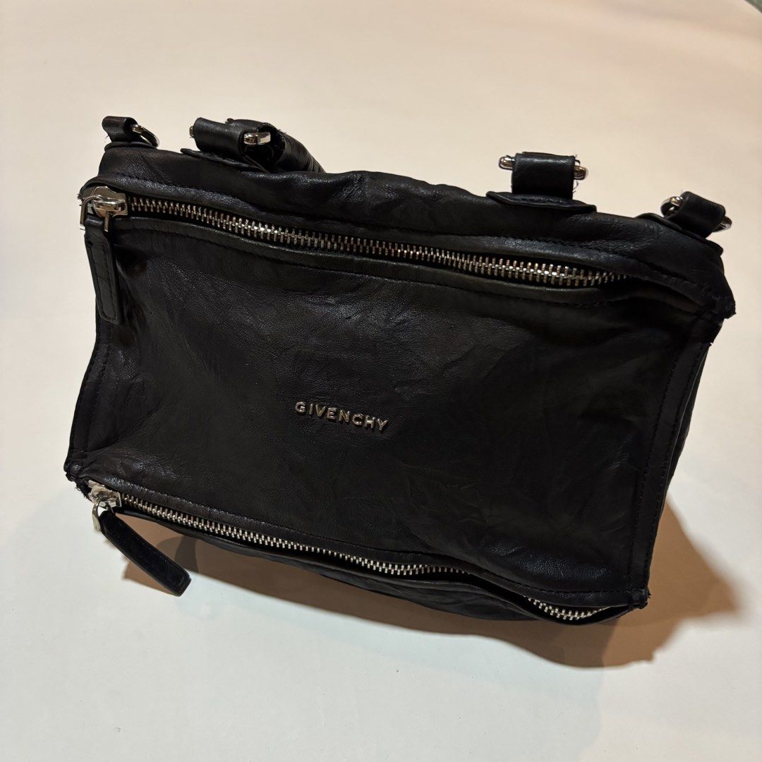 Givenchy Black Leather Nightingale Bag (Category: Luxury Bags & Wallets) located in Dipolog. Submitted by dionato (Listing ID 1449085536, Image 2). Description: - Iconic Givenchy Nightingale bag - Genuine black leather - Made in Italy - Multiple zipper details - Spacious interior - Perfect for everyday or special occasions.