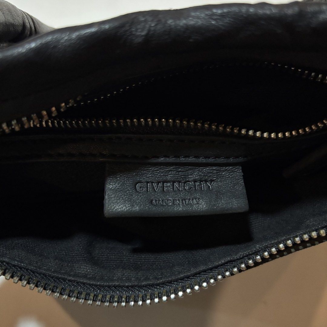 Givenchy Black Leather Nightingale Bag (Category: Luxury Bags & Wallets) located in Dipolog. Submitted by dionato (Listing ID 1449085536, Image 3). Description: - Iconic Givenchy Nightingale bag - Genuine black leather - Made in Italy - Multiple zipper details - Spacious interior - Perfect for everyday or special occasions.