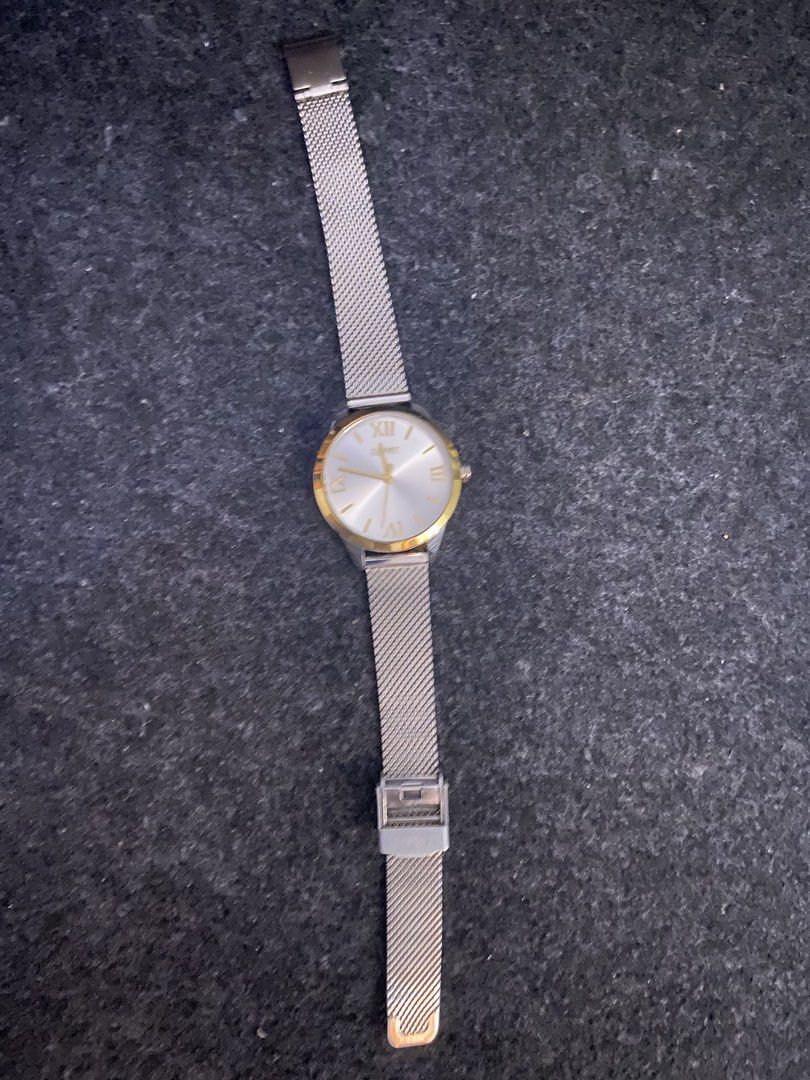 Original ESPRIT Watch (Category: Women's Watches) located in San Pedro. Submitted by chinitagrace21 (Listing ID 1448998392, Image 1). Description: Classic watch with a silver mesh strap. Gold-tone bezel and hands. Roman numerals mark the hours. Simple and elegant design. Great for everyday wear or dressing up. - needs a new battery MONEY BACK GUARANTEE, IF PROVEN FAKE 🙂.