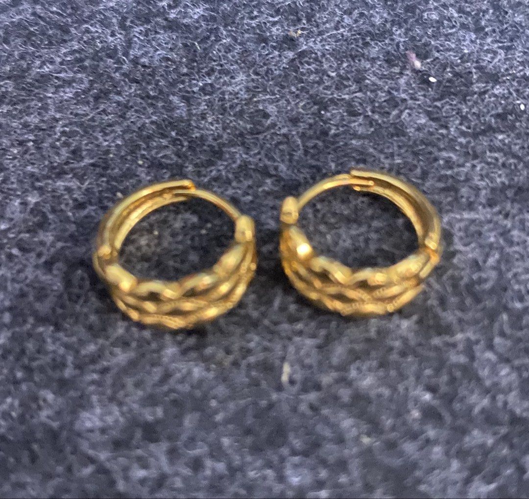 Gold Hoop Earrings with Wavy Design (Category: Earrings) located in San Pedro. Submitted by chinitagrace21 (Listing ID 1448997684, Image 1). Description: - Classic gold plated hoop earrings - Features a stylish wavy pattern on the outside - Versatile for everyday wear or dressing up.