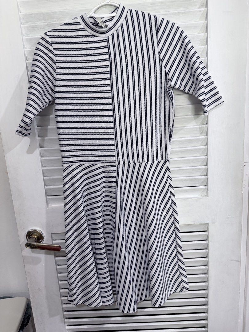 GTW FAB Striped Dress Size M (Category: Dresses) located in Manila. Submitted by leyac (Listing ID 1449092119, Image 2). Description: - Brand: GTW FAB - Style: Black and white striped dress - Design: Asymmetrical stripe pattern on bodice and skirt - Sleeves: Short sleeves - Neckline: Mock neck - Size: Medium (M) - Occasion: Great for casual wear - Isang beses lang ginamit.