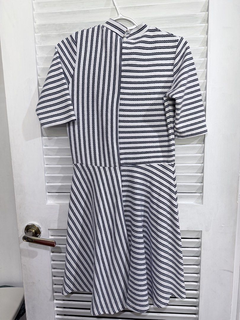 GTW FAB Striped Dress Size M (Category: Dresses) located in Manila. Submitted by leyac (Listing ID 1449092119, Image 1). Description: - Brand: GTW FAB - Style: Black and white striped dress - Design: Asymmetrical stripe pattern on bodice and skirt - Sleeves: Short sleeves - Neckline: Mock neck - Size: Medium (M) - Occasion: Great for casual wear - Isang beses lang ginamit.