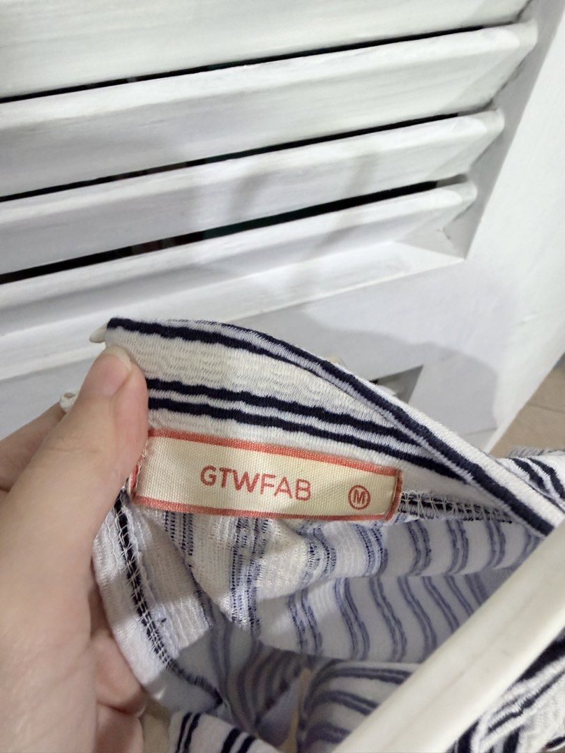 GTW FAB Striped Dress Size M (Category: Dresses) located in Manila. Submitted by leyac (Listing ID 1449092119, Image 3). Description: - Brand: GTW FAB - Style: Black and white striped dress - Design: Asymmetrical stripe pattern on bodice and skirt - Sleeves: Short sleeves - Neckline: Mock neck - Size: Medium (M) - Occasion: Great for casual wear - Isang beses lang ginamit.