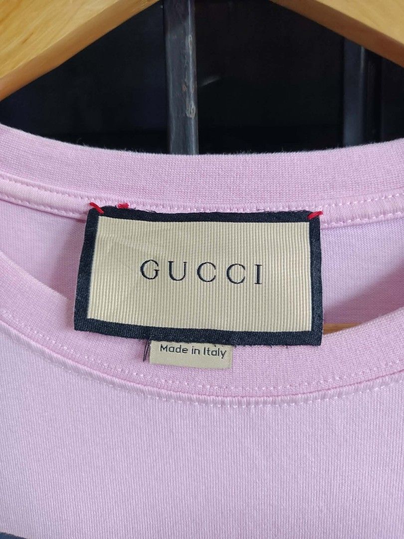 Gucci t-shirt features a large Interlocking G heart (Category: Luxury Apparel) located in Kiblawan. Submitted by kynthoiiithrift (Listing ID 1449008406, Image 3). Description: Minimal crack prints authentic legit 9.5 color rate meduim tag.