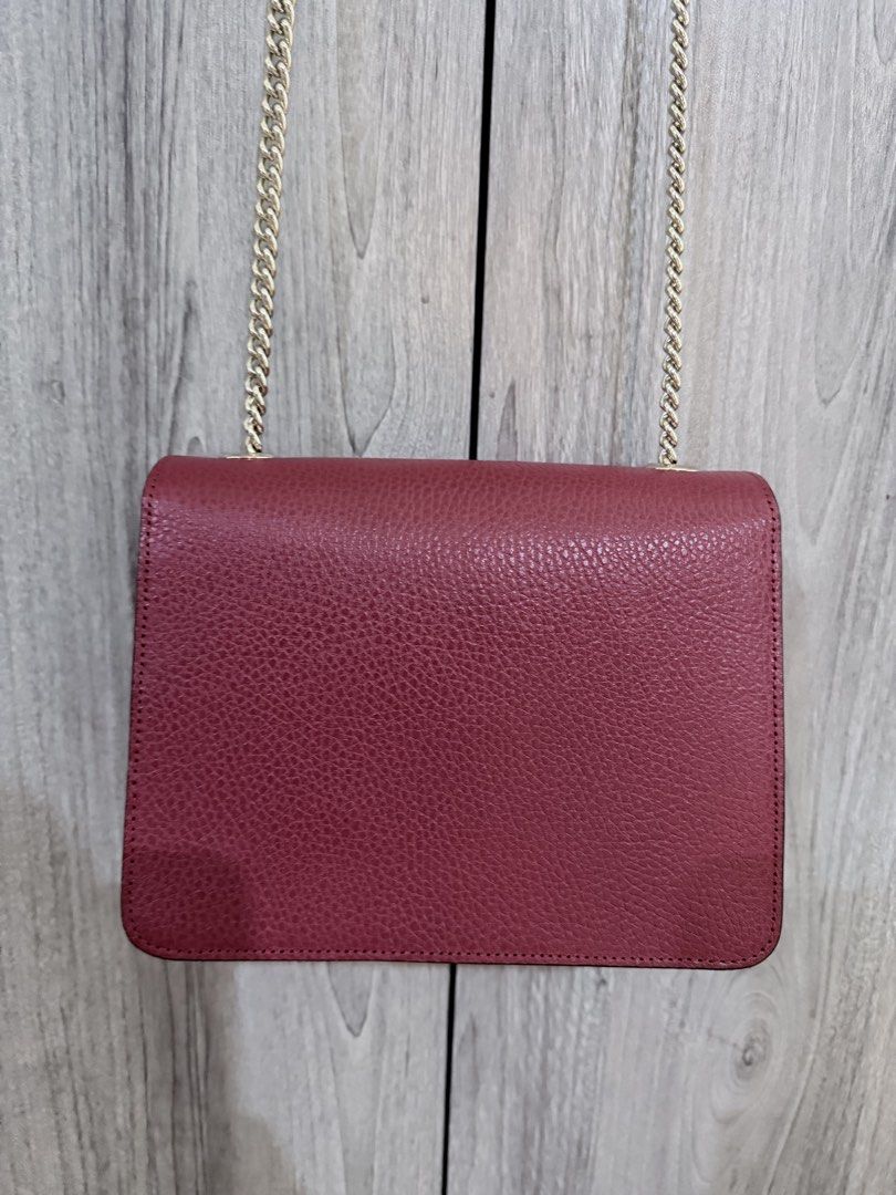 Gucci Interlocking Dollar in Red (Category: Luxury Bags & Wallets) located in Manila. Submitted by vra.luxe (Listing ID 1449021904, Image 2). Description: - Gucci Interlocking Dollar in Red Grained Calfskin Leather - Gold chain strap - Iconic GG logo hardware - Multiple interior compartments - Versatile for day or night use - A timeless classic.