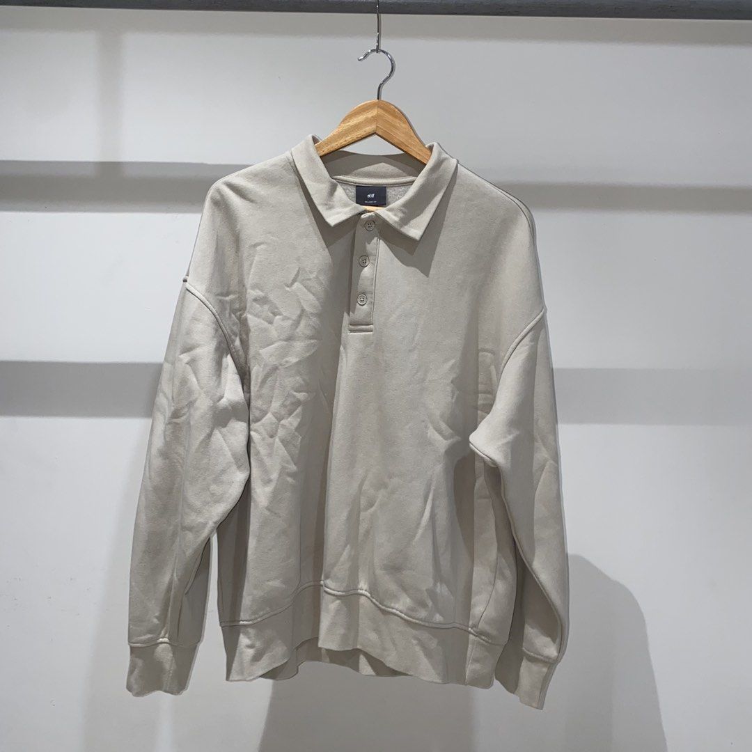h&m beige collar sweatshirt (Category: Tshirts & Polo Shirts ) located in Muntinlupa City. Submitted by declutterwithkk (Listing ID 1449078551, Image 1). Description: - beige h&m sweatshirt - relaxed fit, long sleeves, size XL - polo collar with button closure - soft fleece lining.