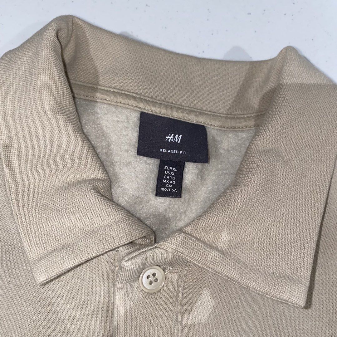 h&m beige collar sweatshirt (Category: Tshirts & Polo Shirts ) located in Muntinlupa City. Submitted by declutterwithkk (Listing ID 1449078551, Image 3). Description: - beige h&m sweatshirt - relaxed fit, long sleeves, size XL - polo collar with button closure - soft fleece lining.