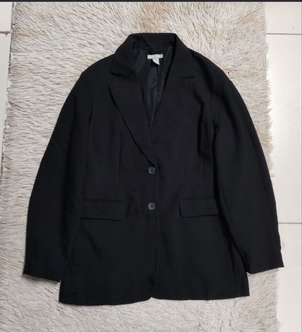 H&M Black Blazer (Category: Coats, Jackets and Outerwear) located in Pasig City. Submitted by jijithepusa (Listing ID 1448926383, Image 1). Description: - Classic black blazer - Two-button closure - Two front pockets - Fully lined interior - Versatile for work or night out - Pairs easily with skirts or trousers.