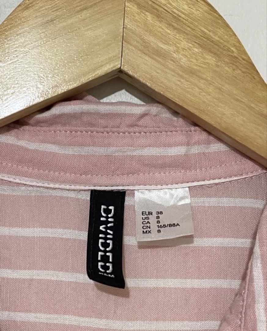 H&M Pink White Striped Long Sleeve Button Up Shirt (Category: Longsleeves) located in Naga. Submitted by Rveebee (Listing ID 1448958721, Image 2). Description: - Brand: H&M - Color: Pink and white stripes - Style: Long sleeve, button-up shirt - Fit: Relaxed - Material feel: Linen blend - Occasion: Casual wear, layering - Styling: Easy to pair with various outfits.