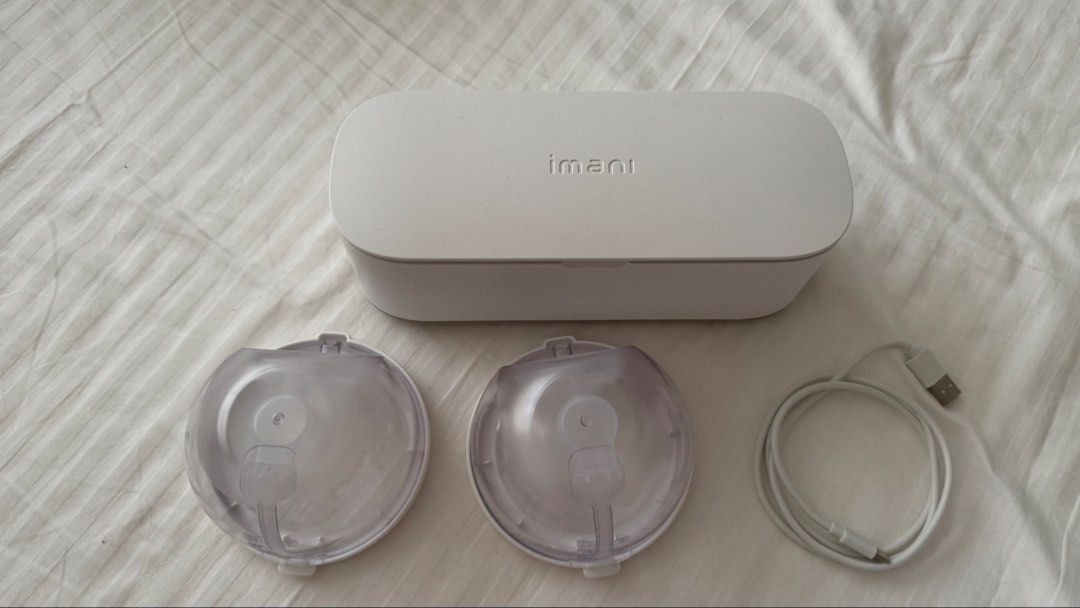 Imani i2 Pro breast pump with Bag (Category: Breastfeeding & Bottle Feeding) located in Muntinlupa City. Submitted by champange101 (Listing ID 1448901659, Image 2). Description: With box Complete set includes: 2 collecting cups 2 motors Charging dock 21mm flange inserts (unused) Lightly used for 2 weeks Pump bag will be included (unused) - unbranded Free: 17, 18, 19mm flange inserts.