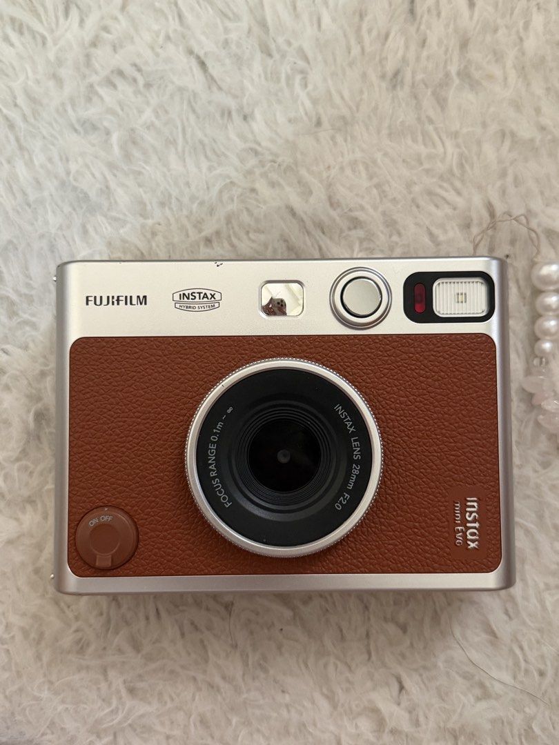 Instax Mini Evo (Category: Cameras) located in Manila. Submitted by wardrobepal (Listing ID 1449097108, Image 1). Description: - Complete inclusion (box, charger, etc.) - With freebies like 32gb sd card, sd card reader for iphone, case, pouch, camera strap and adaptor 🤍🤍🤍 - Conditon: 11/10 - Flaws: Minor scratch due to the clear case :(( BUT OVERALL CONDITION SUPER OK AND SMOOTH - RFS: Decluttering - NEGOTIABLE!! - PM ME FOR MORE PICTURES .