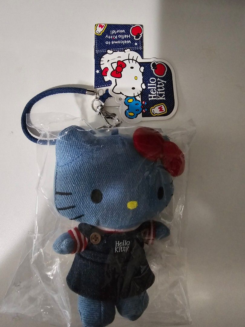 Keychains (Category: Character Goods) located in Singapore. Submitted by natasha20 (Listing ID 1448970192, Image 3). Description: - Set of 2 cute Kitty plush keychains - Keychain 1: Denim with red bow, new in original packaging - Keychain 2: Red hooded Kitty with denim shorts - Both Kitty keychains have tags - Bonus: Disney Store Shanghai keychain with decorative bottle charm - Perfect for Kitty fans, collectors, or as a gift!.