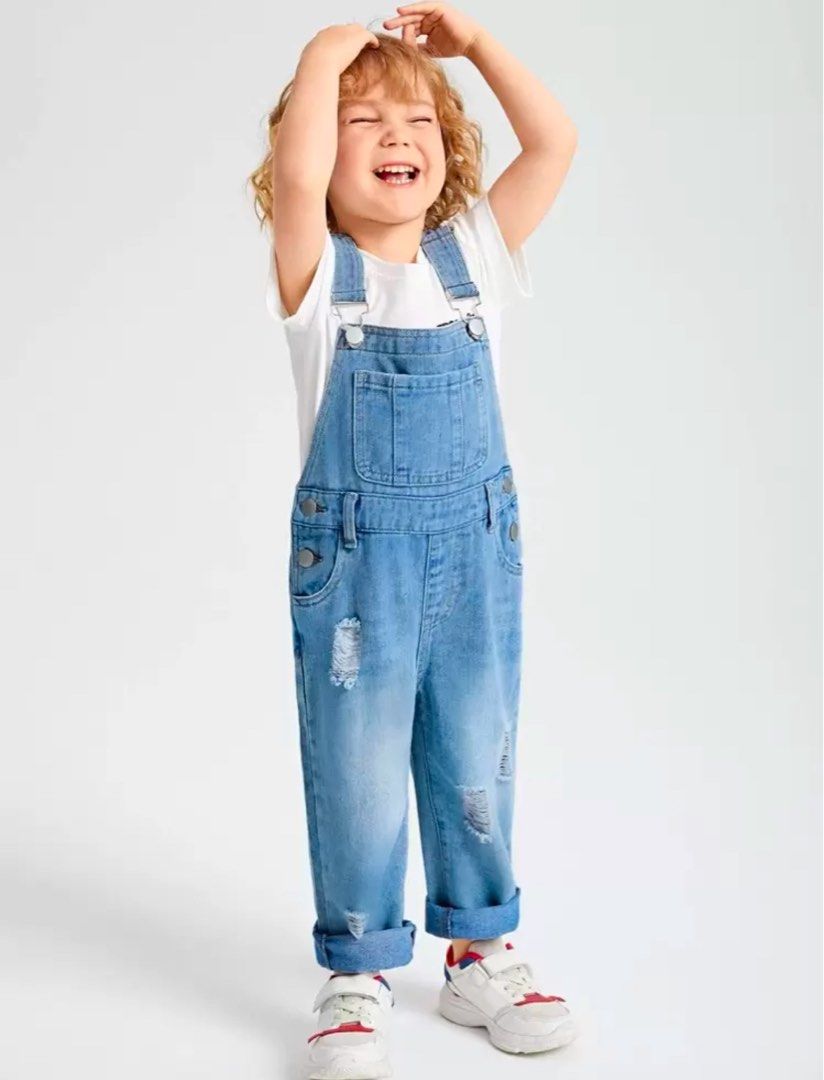 Kids Blue Denim Ripped Overalls (Category: Babies & Kids Fashion) located in Rizal. Submitted by jaimsolshop (Listing ID 1448964327, Image 1). Description: - Adorable blue denim overalls for kids. - Trendy distressed and ripped design on the legs. - Adjustable straps for a comfortable fit. - Easy button closures on the sides. - Stylish cuffed hems. - Ideal for everyday wear and active play. - Size 3-4.