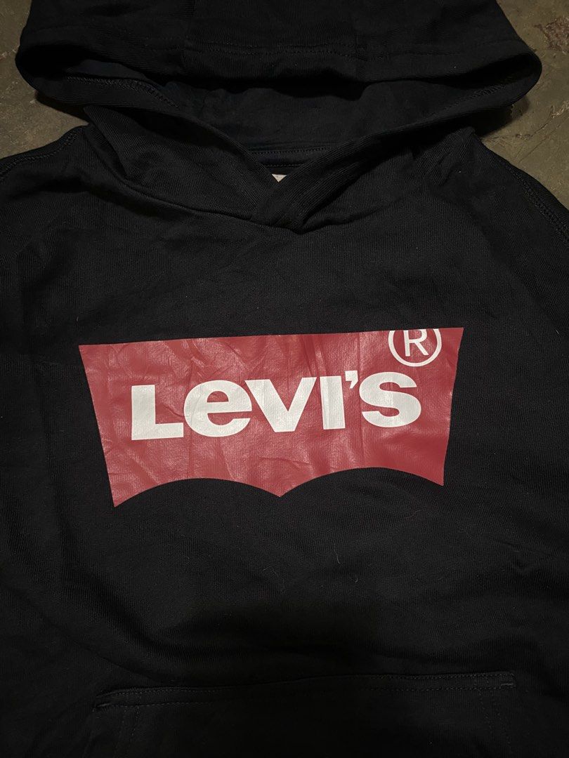 Levi's Black Hoodie with Red Logo (Category: Hoodies) located in Malabon City. Submitted by yivsthrift (Listing ID 1449071635, Image 2). Description: - Classic black Levi's hoodie - Iconic red Levi's logo on chest - Front pocket and hood - Made from 100% cotton - Size L (140/66) - Great for everyday wear.