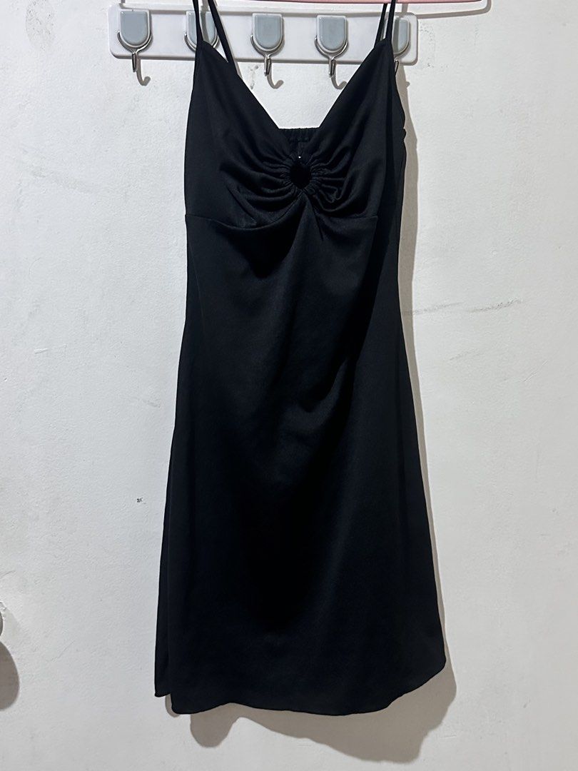 Little Black Ruched O-Ring Mini Dress (Category: Dresses) located in Baguio. Submitted by misty_dae (Listing ID 1449088296, Image 2). Description: Style: Mini dress silhouette with delicate spaghetti straps. Color: Solid, classic black. Front Design: Highlights a flattering V-neckline accented by a fabric-covered O-ring at the center, which creates an elegant ruched effect across the bust. Back Design: Features a simple, slightly scooped backline