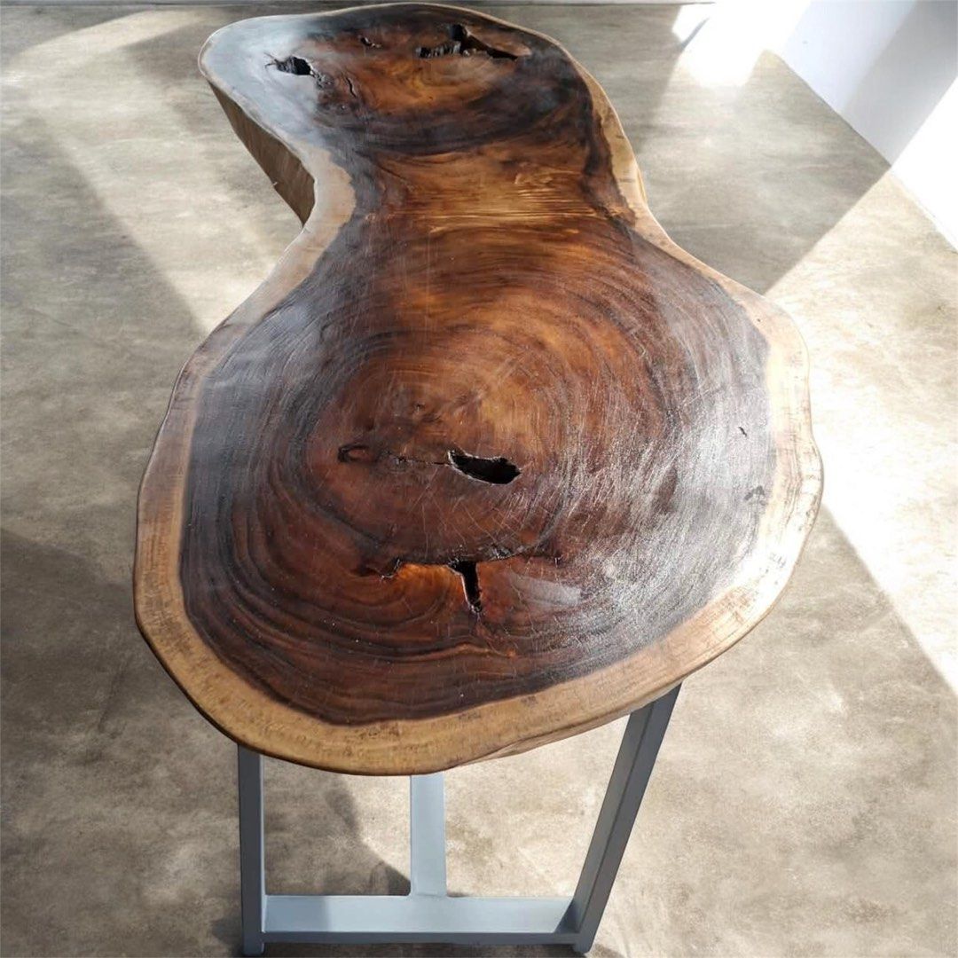 Live Edge Walnut Coffee Table with Metal Legs (Category: Tables & Sets) located in Pasig City. Submitted by casambhomedecors (Listing ID 1448917685, Image 1). Description: - Unique live edge coffee table - Solid walnut wood with natural curves and character - Beautiful grain patterns and natural voids - Sturdy, modern metal base - Perfect statement piece for any living room.