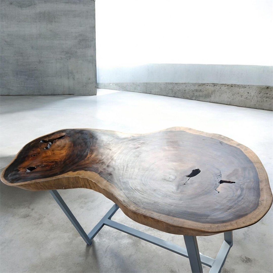 Live Edge Walnut Coffee Table with Metal Legs (Category: Tables & Sets) located in Pasig City. Submitted by casambhomedecors (Listing ID 1448917685, Image 2). Description: - Unique live edge coffee table - Solid walnut wood with natural curves and character - Beautiful grain patterns and natural voids - Sturdy, modern metal base - Perfect statement piece for any living room.
