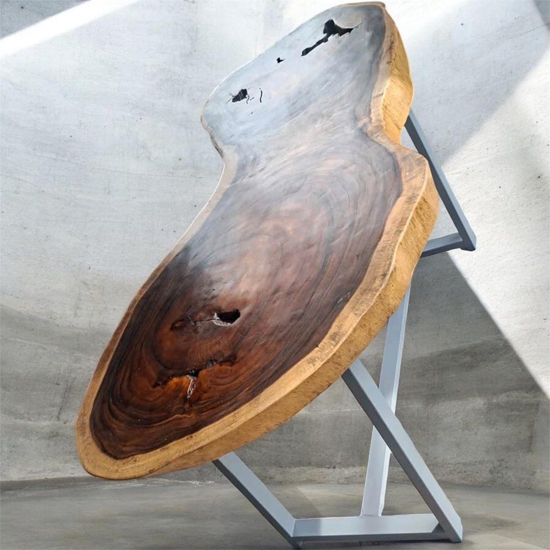 Live Edge Walnut Coffee Table with Metal Legs (Category: Tables & Sets) located in Pasig City. Submitted by casambhomedecors (Listing ID 1448917685, Image 3). Description: - Unique live edge coffee table - Solid walnut wood with natural curves and character - Beautiful grain patterns and natural voids - Sturdy, modern metal base - Perfect statement piece for any living room.