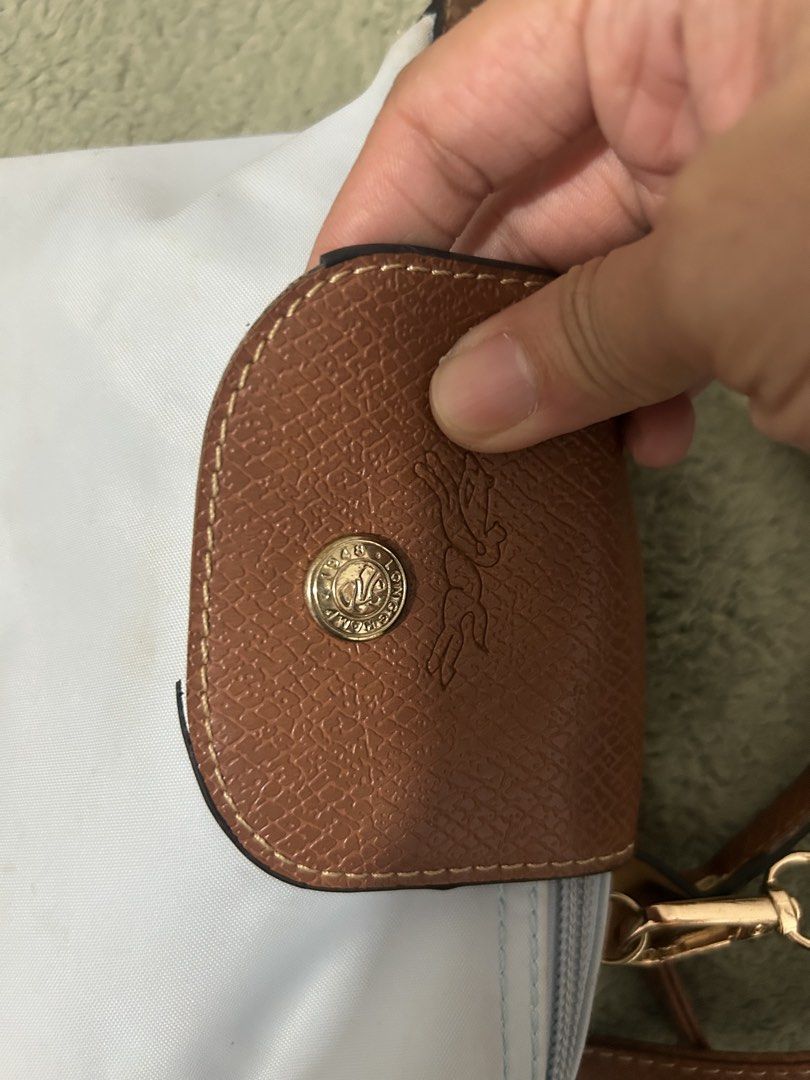 Authentic Longchamp Le Pliage Cuir Small Shoulder Bag Light Blue (Category: Luxury Bags & Wallets) located in Las Pinas. Submitted by ladyattire (Listing ID 1449030692, Image 2). Description: - Light blue Longchamp bag - Small size, perfect for essentials - Brown leather trim and strap - Top handle and long adjustable strap - Zipper closure - Gold hardware -Authentic.