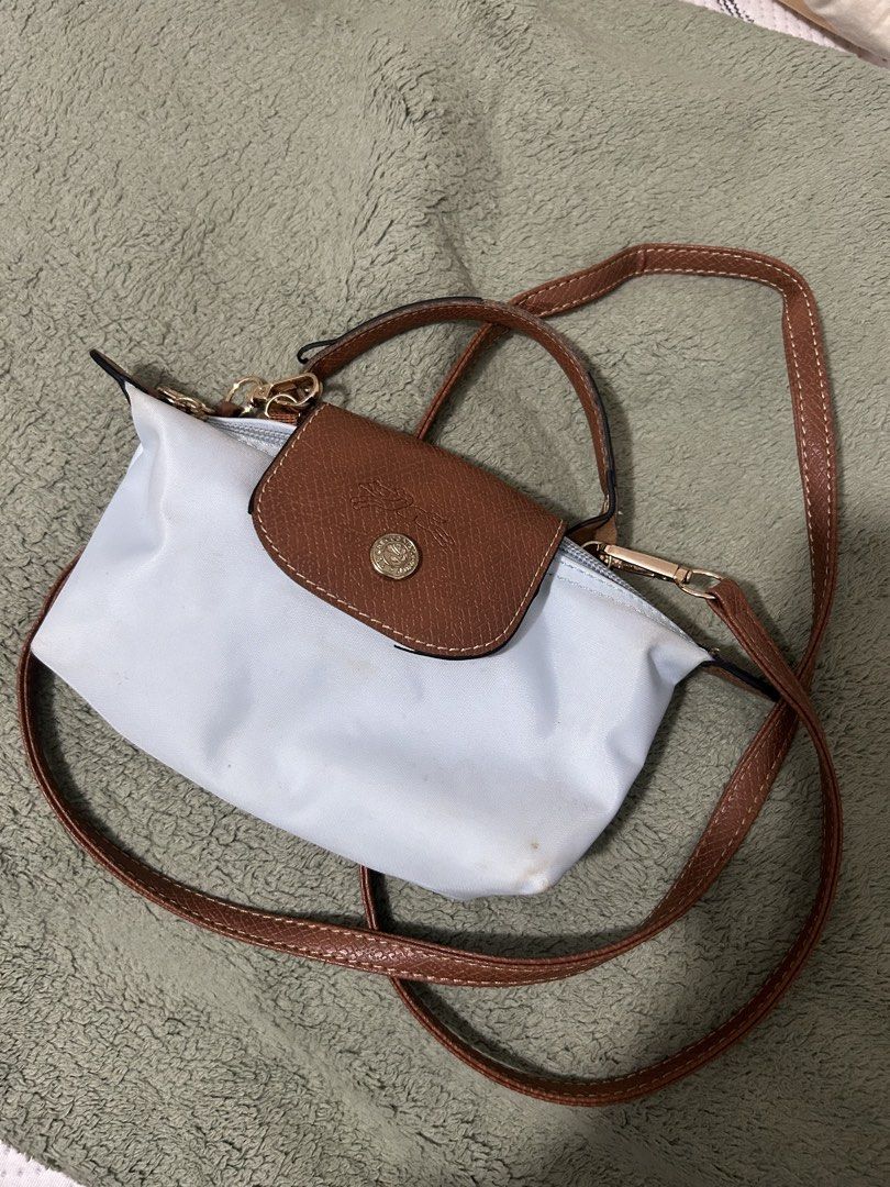 Authentic Longchamp Le Pliage Cuir Small Shoulder Bag Light Blue (Category: Luxury Bags & Wallets) located in Las Pinas. Submitted by ladyattire (Listing ID 1449030692, Image 1). Description: - Light blue Longchamp bag - Small size, perfect for essentials - Brown leather trim and strap - Top handle and long adjustable strap - Zipper closure - Gold hardware -Authentic.
