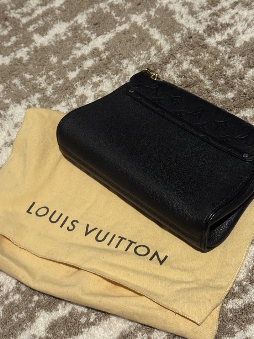 Louis Vuitton Black Leather Monogram Chain Shoulder Bag (Category: Luxury Bags & Wallets) located in Makati City. Submitted by declutter_forsale (Listing ID 1449082319, Image 3). Description: - Authentic Black Louis Vuitton Shoulder Bag - Bought in Makati Greenbelt Louis Vuitton (can bring the bag to check with staff in person) - Louis Vuitton Saint Sulpice PM in Black Monogram Empreinte Leather - Textured leather with iconic embossed monogram - 