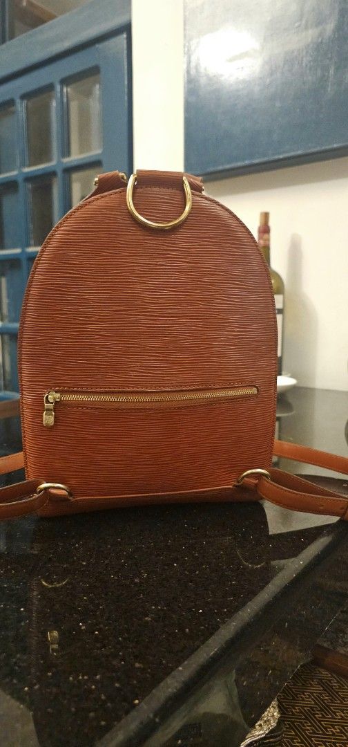 Louis Vuitton Mabillon Epi Leather Backpack (Category: Luxury Bags & Wallets) located in Calamba. Submitted by linda.gonzales (Listing ID 1448915237, Image 3). Description: - Authentic Louis Vuitton Vintage backpack in very good condition - Classic Rust Color in durable Epi Leather and Gold Hardware - Timeless and unique elongated teardrop shape - Features: Adjustable straps, Gold Metal top handle, double zip closure and outer back zipper pocket 