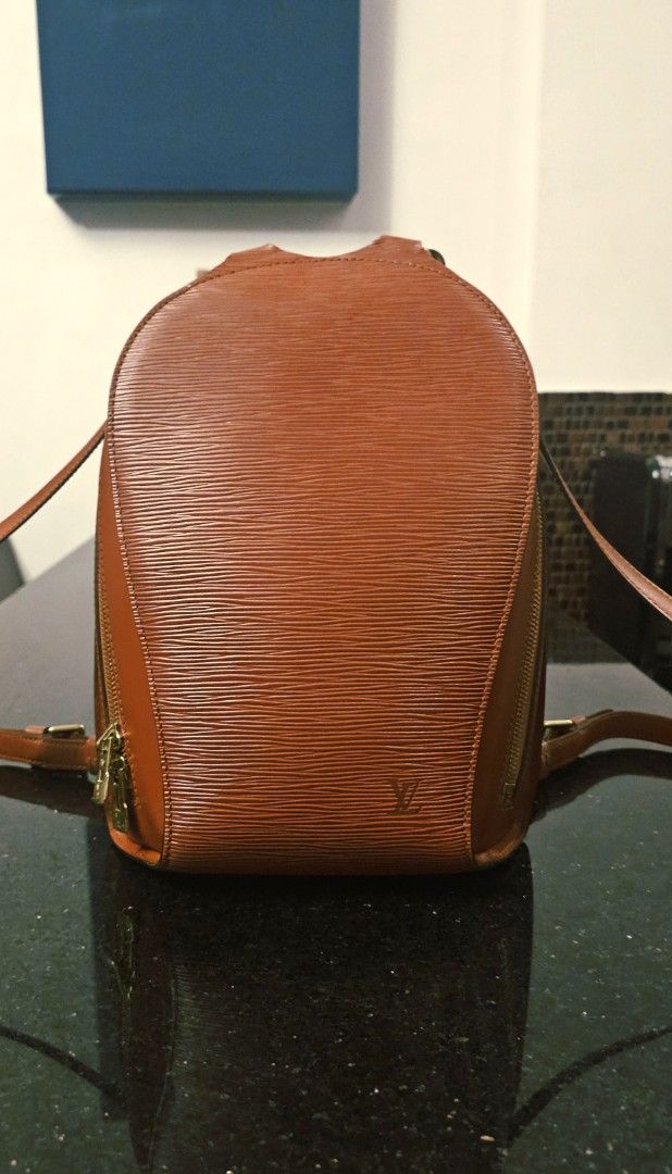Louis Vuitton Mabillon Epi Leather Backpack (Category: Luxury Bags & Wallets) located in Calamba. Submitted by linda.gonzales (Listing ID 1448915237, Image 1). Description: - Authentic Louis Vuitton Vintage backpack in very good condition - Classic Rust Color in durable Epi Leather and Gold Hardware - Timeless and unique elongated teardrop shape - Features: Adjustable straps, Gold Metal top handle, double zip closure and outer back zipper pocket 