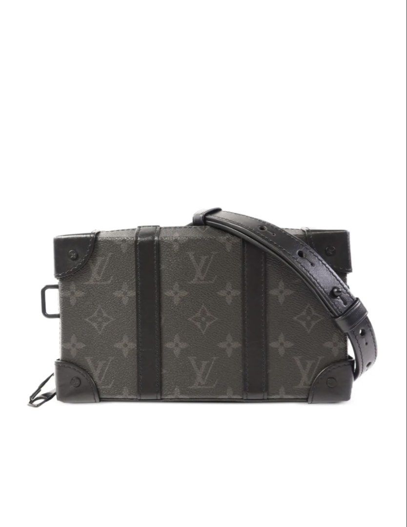 Louis Vuitton Soft Trunk Monogram Eclipse Crossbody & Clutch Bag (Category: Luxury Bags & Wallets) located in Makati City. Submitted by luxebrands88 (Listing ID 1448979557, Image 1). Description: - Authentic Louis Vuitton Crossbody / Clutch Bag - Bought from Greenbelt. - Classic Black monogram eclipse canvas - Versatile: Removable strap for crossbody wear - Functional interior with multiple card slots - Comes with original dust bag - Ideal for ev