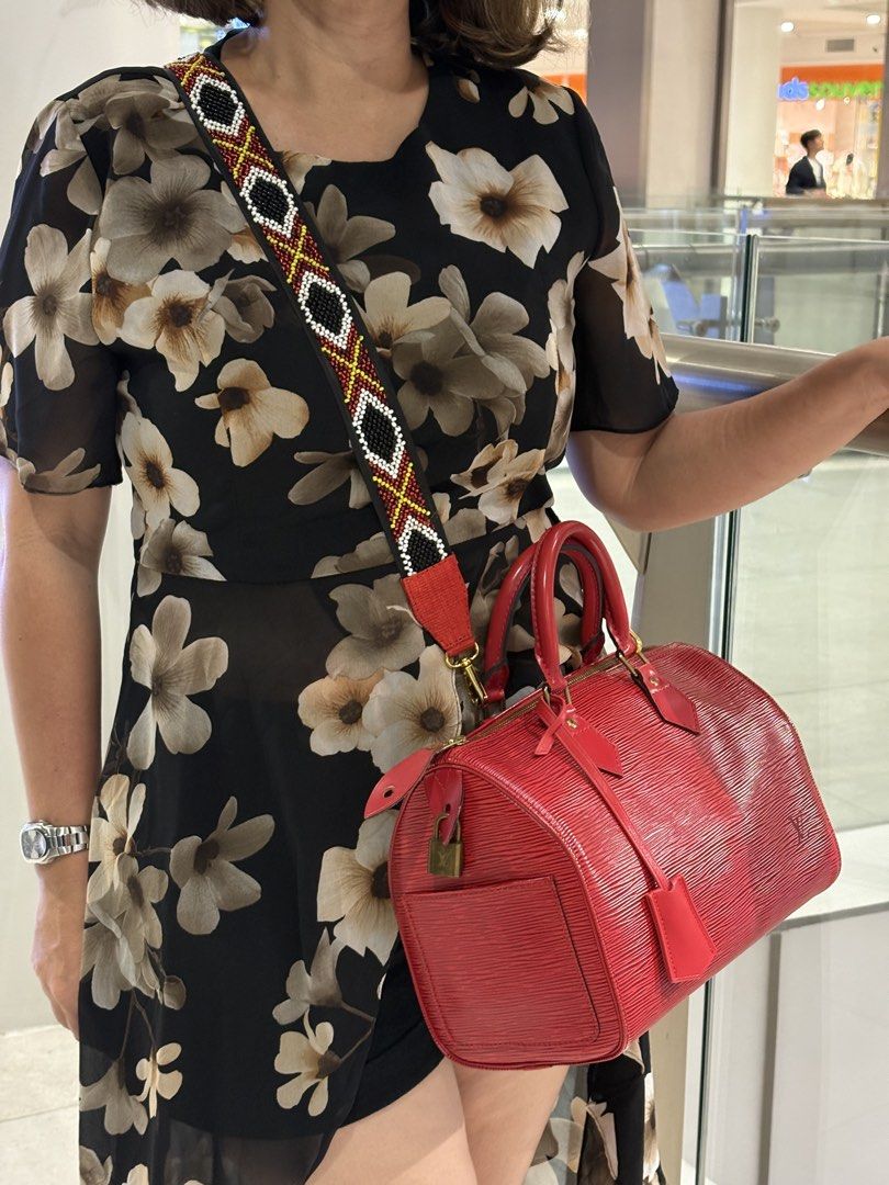 Louis Vuitton Speedy 25 (Category: Luxury Bags & Wallets) located in Mandaue City. Submitted by zealhawk_ca52e0 (Listing ID 1448920612, Image 2). Description: - Authentic Red Louis Vuitton Speedy Bag - size 25 - Durable Epi Leather - Comes with original lock but no key - with dust bag - Includes a stylish, colorful beaded strap for customization - Versatile: Great for everyday use or special events - Condition: Good.