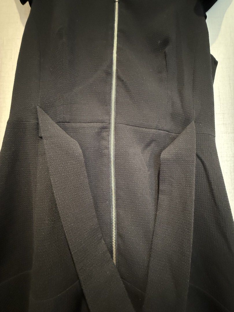Mango Suit Black Zipper Dress (Category: Dresses) located in Quezon City. Submitted by shopkall (Listing ID 1449085034, Image 3). Description: - Stylish black mango suit dress - Functional front zipper closure - Flattering ruffle sleeves - Elegant flared hem - Convenient side pockets - Versatile for both work and night out occasions.