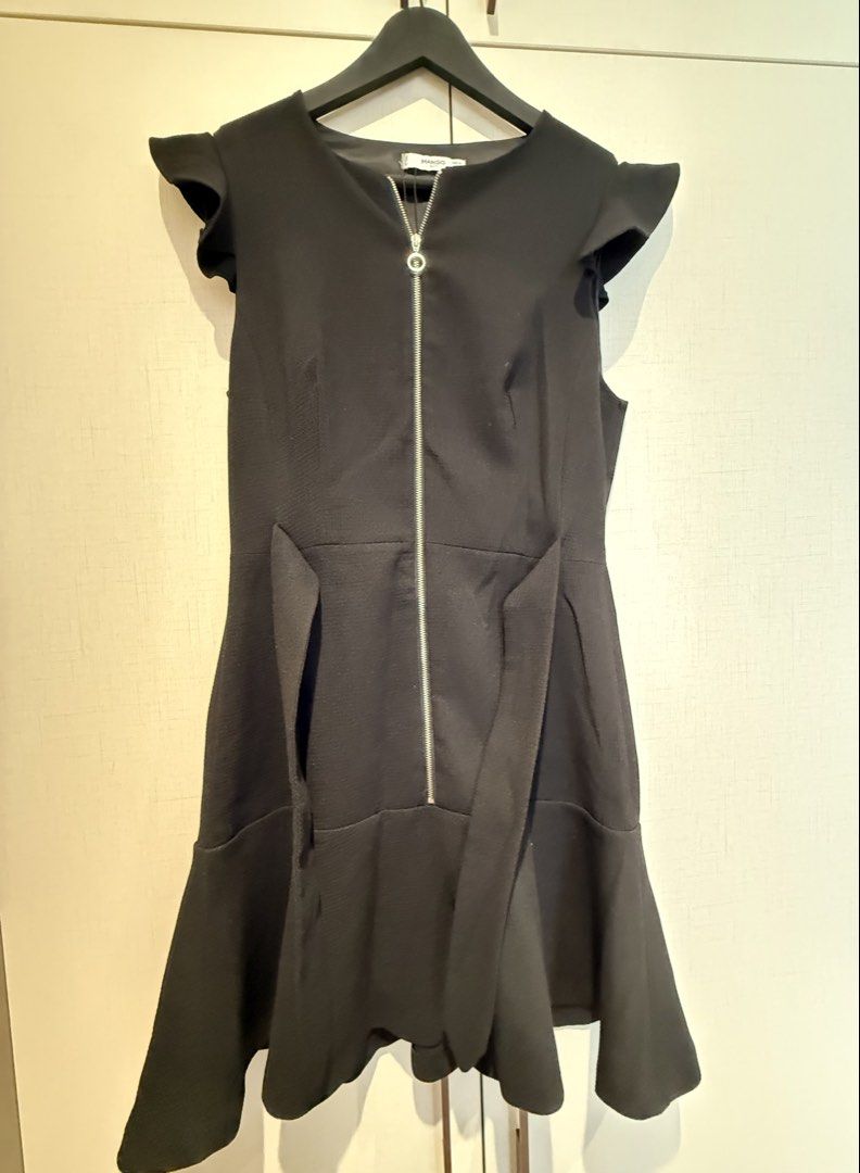 Mango Suit Black Zipper Dress (Category: Dresses) located in Quezon City. Submitted by shopkall (Listing ID 1449085034, Image 1). Description: - Stylish black mango suit dress - Functional front zipper closure - Flattering ruffle sleeves - Elegant flared hem - Convenient side pockets - Versatile for both work and night out occasions.
